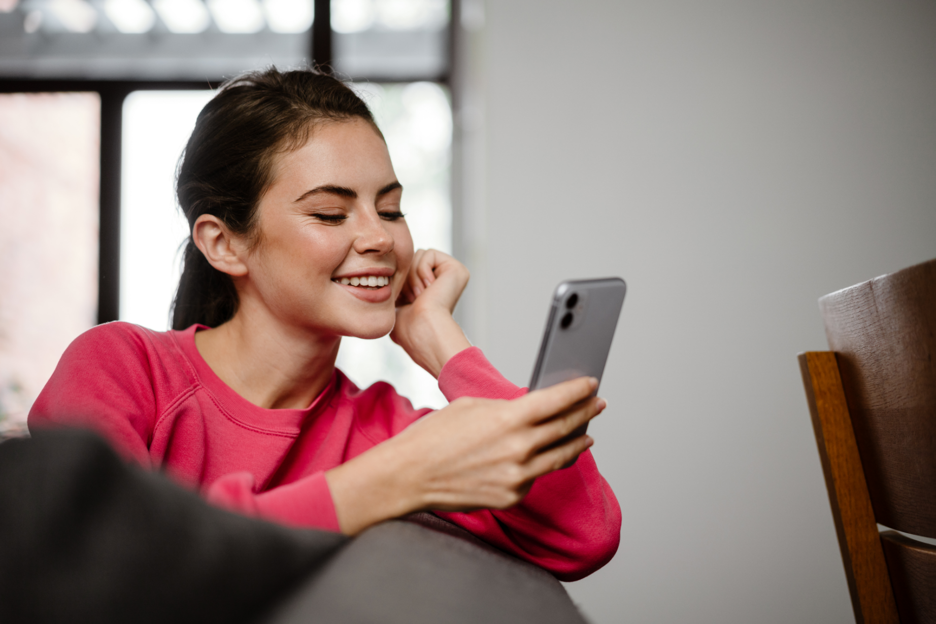 Happy customer using phone